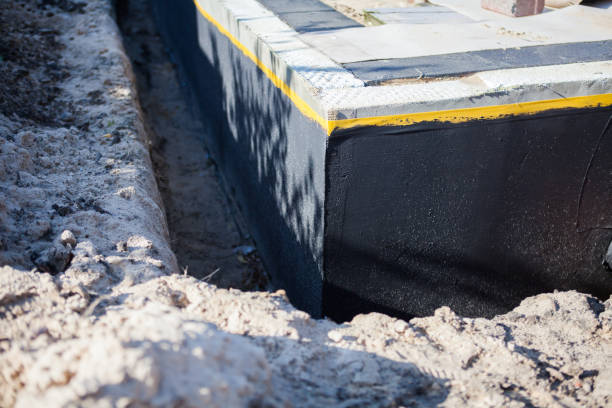 Professional Waterproofing technician working in Hendersonville, NC
